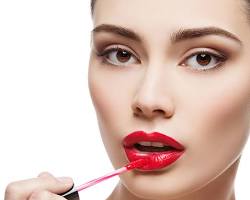Image of applying lip gloss makeup