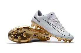 white and gold cleats