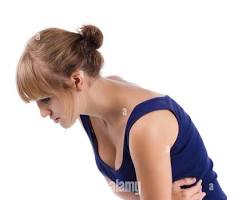 Image of someone holding their stomach in pain