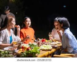 Gambar angkringan food stall with people enjoying a meal and conversation.