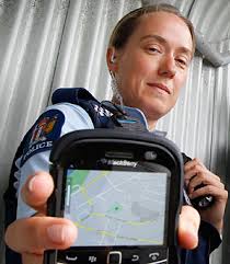 ROBO COP: Lower Hutt police constables Harriet Murray using a blackberry on the beat. - 6454115