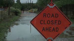 Flooding in Santa Fe County with submerged roads and isolated homes