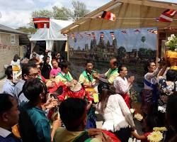 Image of Family members gathering at a pagoda