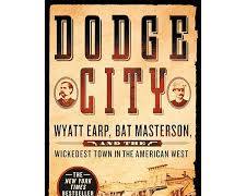 Image of Bat Masterson, a fellow lawman and friend of Wyatt Earp, standing beside him on a Dodge City street