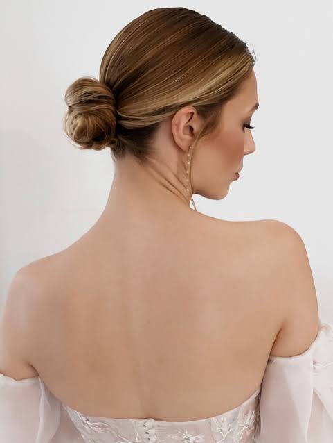 Elegant. Timeless. Polished. The low sleek bridal bun never misses ...
