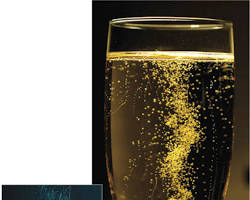 wine glass filled with Prosecco with bubbles rising