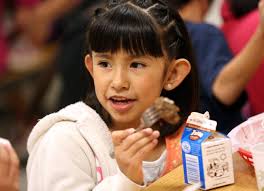 Juanita Contreras eats teriyaki beef stir fry during lunch at Woodrow Wilson Elementary in Salt Lake City on Thursday, Oct. 31, 2013. - 1243180