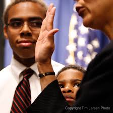 Taylor and younger brother Justin watch as their mom Paula Dow is sworn in as the new New Jersey Attorney General. I just love the look of respect these ... - 20100223agswearinn109_blog