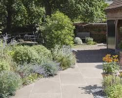 Image of outdoor patio featuring natural stone pavers