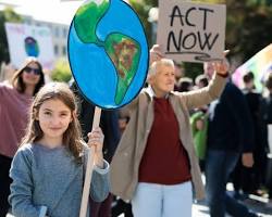 Greta Thunberg planting trees with other climate activists