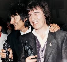 Rock king: Bill Wyman with Ronnie Wood picking up their Ivor Novello awards in 1991 - article-2301867-005DC6A100000258-824_634x589