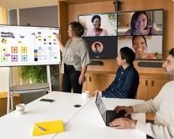 Image of person teaching online, using a whiteboard and video conferencing