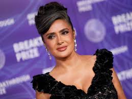 Salma Hayek Embraces Her Natural Gray Hair in a Swooping Updo With a Plunging Sheer LBD