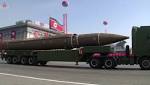 Korea displays ICBMs during low-key