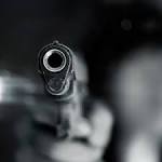 kills robber, injures others