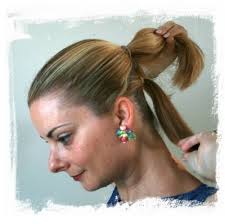 For an quick pony, pull your hair back into a ponytail as seen in the first picture. For the complicated do, split your hair into two ponytails, ... - a%2Btwo%2Bponytails%2B1