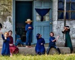 Image of Amish people in traditional clothing