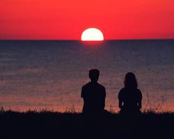 Image of person looking at a sunset