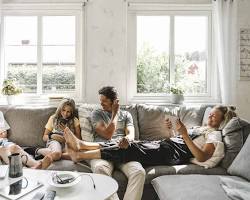 Image of family sitting in their living room