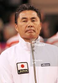 Caption: Limoges, FRANCE: Japanese tennis national team captain Minoru Ueda ... - 73940247-limoges-france-japanese-tennis-national-team-gettyimages