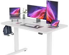 1200mm electric heightadjustable table with multiple monitors, laptops, and documents arranged on its spacious surface