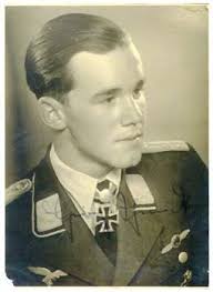 Leutnant <b>Heinz Schmidt</b> displaying his. recently awarded Oakleaves to the - a56ff5e0
