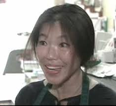 Ping Chiu, owner of Cheese Magic in Kensington Market, had to throw out $1,000 worth of cheese because of a listeria concern. ((CBC)) - ping-chiu082808