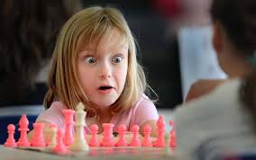 Cassandra Wright, 6, of Penngrove, reacts to a move by her opponent, Saturday February 20, 2010 at Ursuline High School in Santa Rosa Ca., during a chess ... - chess3