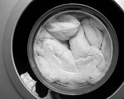 Image of washing bedding in hot water
