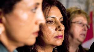 Members of the Air India Victims families Association Lata Pata, left to right, Daljit Kaur Sidhu, and Monique Castonguay listen to a press conference in ... - image