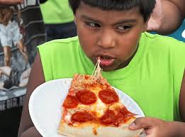 Al Campanie / The Post-StandardMartin Romero , 8 of Syracuse enjoys some pizza at the Taste of Syracuse in Clinton Square last year. - dsc-3867jpg-c769fe8b291d0766_large