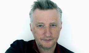 &#39;Look out the window, Jon,&quot; says Billy Bragg, bounding from a low-slung taupe armchair in a swish hotel room that&#39;s every shade of brown. - Billy-Bragg-singer-and-so-007