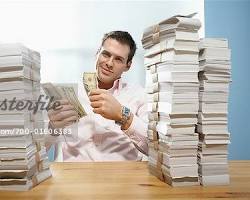 Image of person counting stacks of money