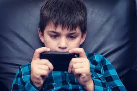 Kid Playing On Cell Phone Stock Photo 154145512 ... - 154145512-kid-playing-on-cell-phone-gettyimages
