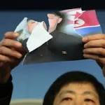 Activists rip Kim Jong Un's photo in Olympic protest by WWN24 Activists rip Kim Jong Un's photo in Olympic protest by WWN24