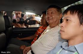 Tan Chu Seng arriving at court last month. The delivery driver was remanded for another two weeks for psychiatric assessment. Elena Chong. The Straits Times - 20140401_sph_Tan-Chu-Seng