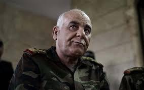 General Mustafa Sheikh (L) holds a speech during a meeting at the Supreme Military Council Head Quarter Photo: ALESSIO ROMENZI - syria4_2347488b