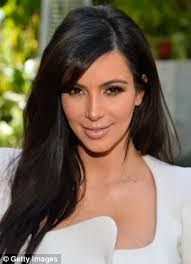 Kim Kardashian can earn up to Â£7,000 for a single 140-character tweet if - article-2356475-189355F6000005DC-469_306x423