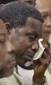 Solomon Davis, the father of death row inmate Brian Darrell Davis, wipes his tears away after - solomon-davis