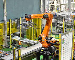 Image of robot arm working in a factory