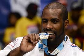French gold medalist Teddy Riner poses after the medal ceremony for the men&#39;s +100kg category during a World Judo Championships at Gymnasium Maracanazinho ... - teddy-riner-1889608