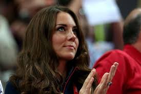 The Duchess of Cambridge got her hands on a Paralympics gold medal yesterday - as she presented GB winner Aled Davies with his prize. - Kate%2520middleton
