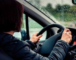 Image of person nervously gripping the steering wheel