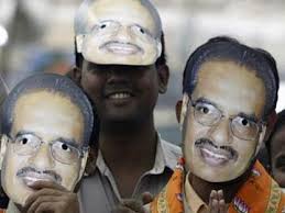 FILE photo: BJP workers wearing masks of Madhya Pradesh Chief Minister Shivraj Singh Chouhan attend an election campaign rally at Vidisha district, ... - Shivraj_Singh_Chouhan_posters_Reuters_360