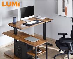 professional working at a 1200mm electric heightadjustable table in a modern, welllit office