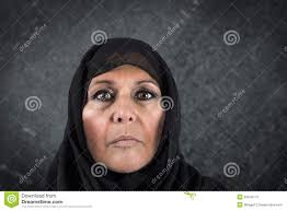 Dramatic muslim woman - dramatic-muslim-woman-portrait-serious-middle-aged-black-scarf-hijab-34545110