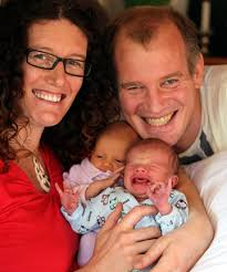 Jodie and Richard Gould with their new arrivals, Keisha, left, and Jesse. DON SCOTT/Fairfax NZ. FAMILY TRADITION: Jodie and Richard Gould with their new ... - 7296885