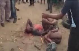 Image result for mob strips 2 suspected homosexuals  in nigeria