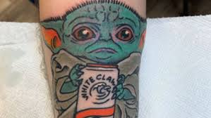 This dude got a tattoo of Baby Yoda drinking a White Claw | Mashable
