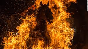 Image result for horseman jumps over fire
